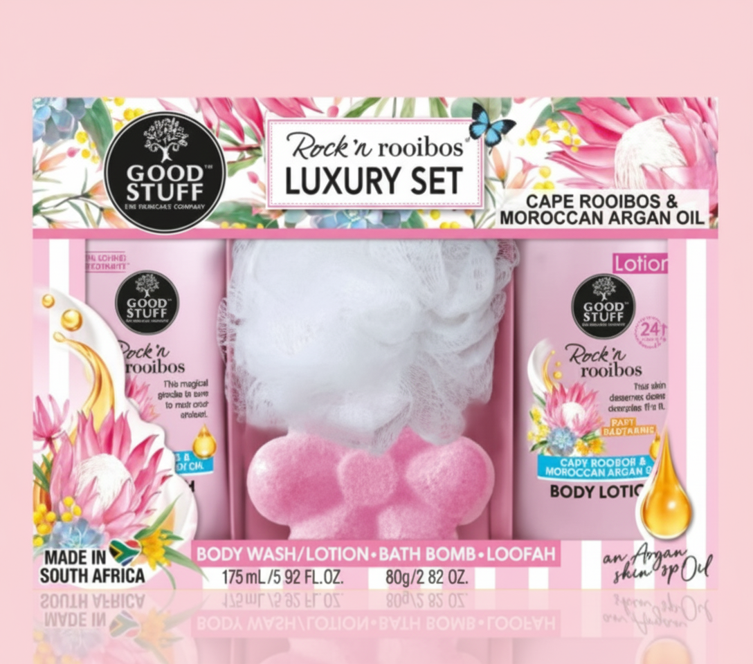 Good Stuff Rock 'n Rooibos luxury set packaging with body wash, lotion, bath bomb, and loofah on a pink background.